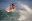 Bare-chested surfer riding a wave